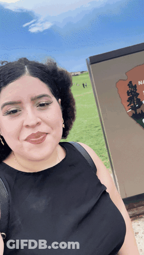 Woman Photographing National Park Sign GIF