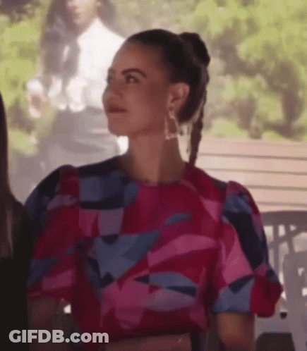 Woman Pink Blue Dress With Others On Bench GIF