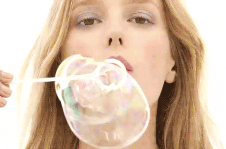 Woman Playing Bubbles GIF