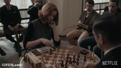 Woman Playing Chess With Netflix Logo GIF