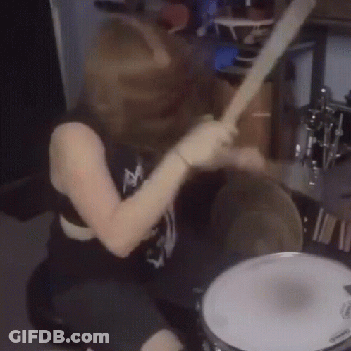 Woman Playing Drum Set With Evans Drum Head GIF