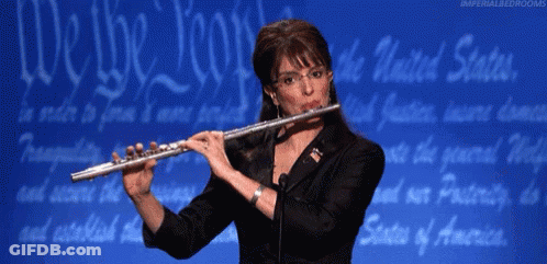 Woman Playing Flute Blue Background Saying We The People GIF