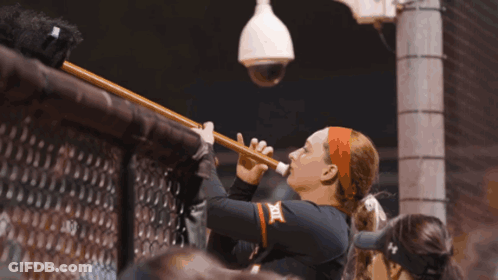 Woman Playing Flute With X On Chest GIF
