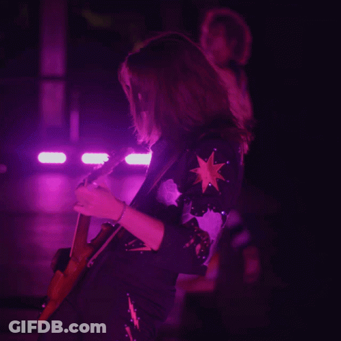 Woman Playing Guitar In Purple Light GIF