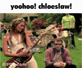 Woman Playing Guitar Man Watching In Grass GIF