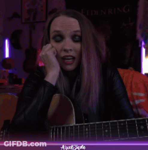 Woman Playing Guitar With Elden Ring Banner GIF