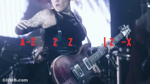 Woman Playing Guitar With Letters A-Z-Z-Z-X GIF