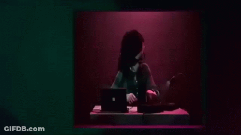 Woman Playing Keyboard In Dark Room GIF