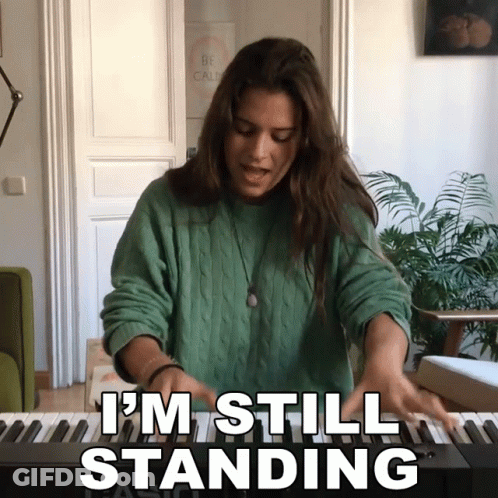 Woman Playing Piano Saying I'm Still Standing GIF