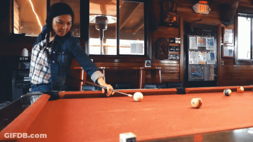 Woman Playing Pool In Bar GIF