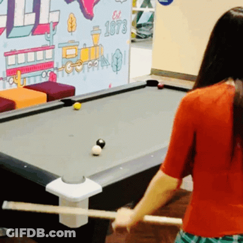 Woman Playing Pool In Front Of Est 1973 Wall GIF