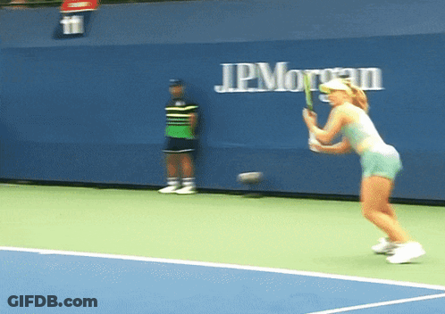 Woman Playing Tennis In Front Of JPMorgan Wall GIF