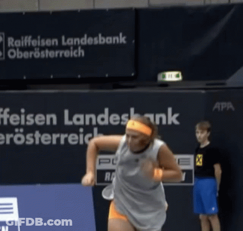 Woman Playing Tennis In Front Of Raiffeisen Landesbank Sign GIF
