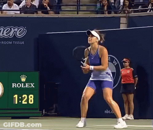 Woman Playing Tennis In Front Of Rolex Advertisement GIF