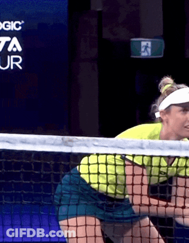 Woman Playing Tennis In Front Of Toyota Ad GIF