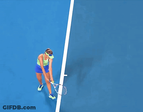 Woman Playing Tennis On Blue Court With Kia Ads GIF
