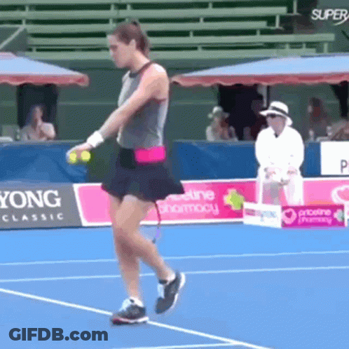 Woman Playing Tennis On Court With Super Yong Classic Sign GIF