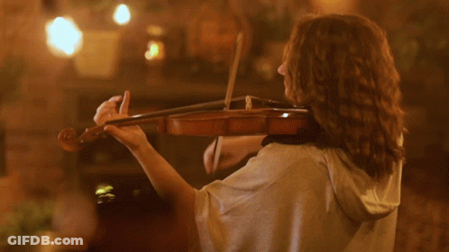 Woman Playing Violin With Hood GIF