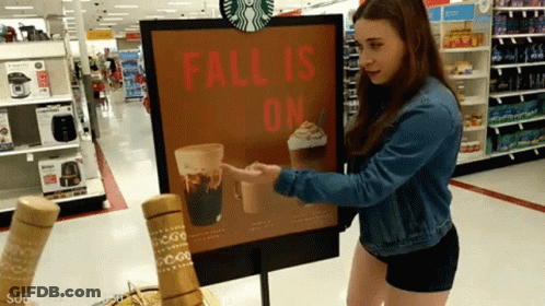 Woman Pointing At Starbucks Fall Is On Sign GIF