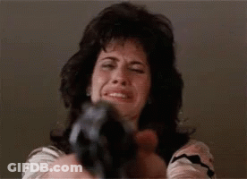 Woman Pointing Gun At Camera While Crying GIF