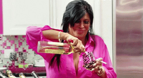 Woman Pouring Bottle Of Wine Into Glass GIF
