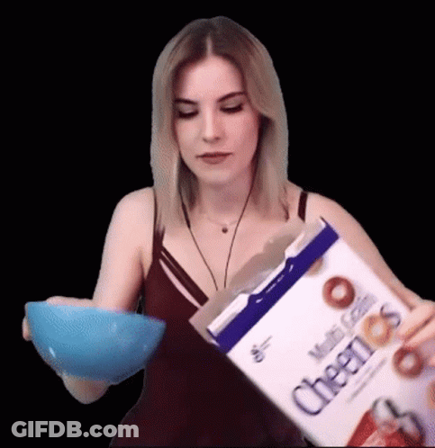 Woman Pouring Cheerios Into Hand GIF