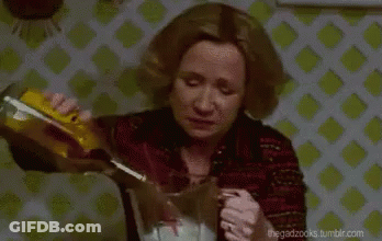 Woman Pouring Drink Into Glass GIF
