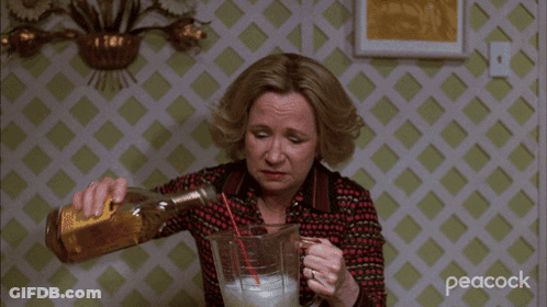 Woman Pouring Drink Into Peacock Pitcher GIF