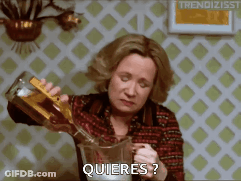 Woman Pouring Drink With Quieres GIF