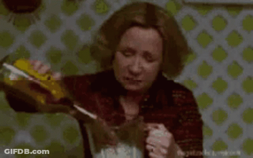 Woman Pouring Into Pitcher With Mixer GIF
