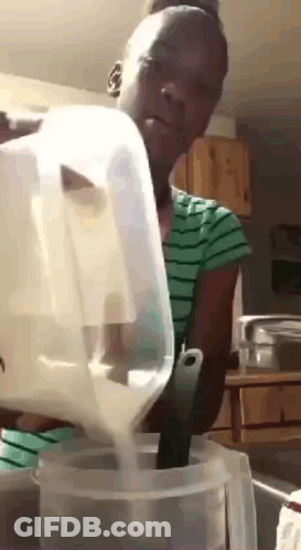 Woman Pouring Milk Into Plastic Container With Spoon GIF