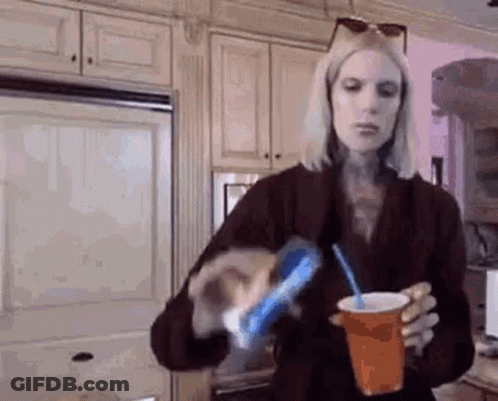 Woman Pouring Soda Into Cup With Straw GIF