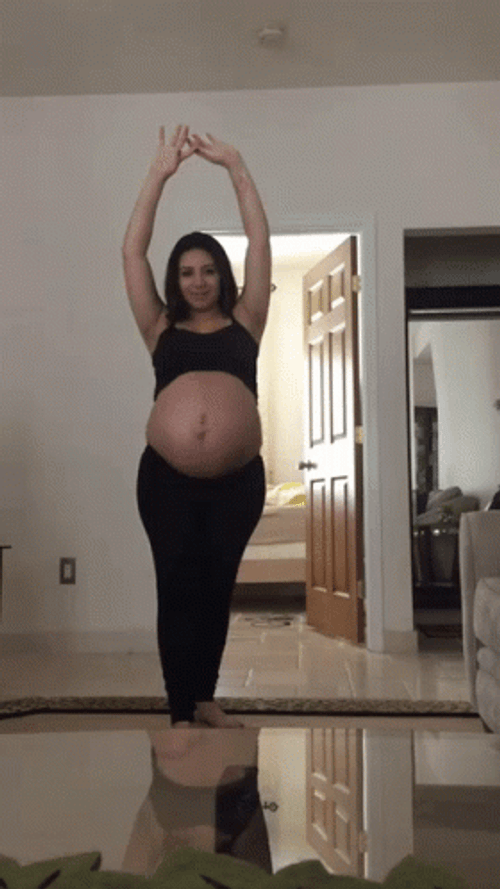 Woman Pregnant Belly Doing Yoga GIF