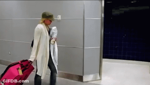 Woman Pulling Pink Suitcase GIF