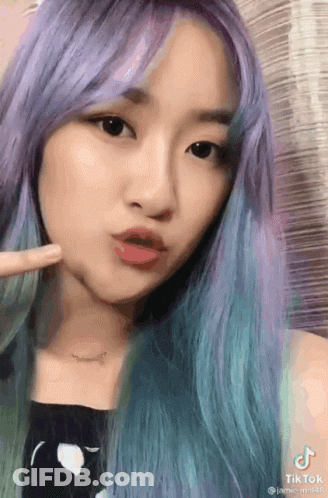 Woman Purple Blue Hair Making Funny Face Necklace GIF