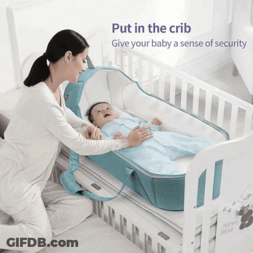 Woman Putting Baby In Crib With Text Put In The Crib Give Your Baby Security GIF