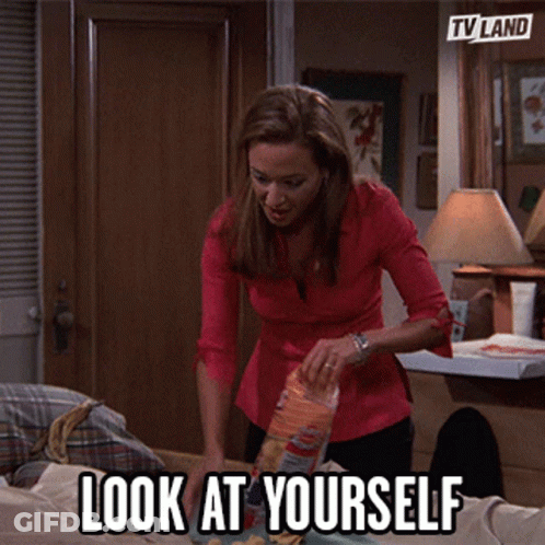 Woman Putting Bag Of Chips On Table GIF
