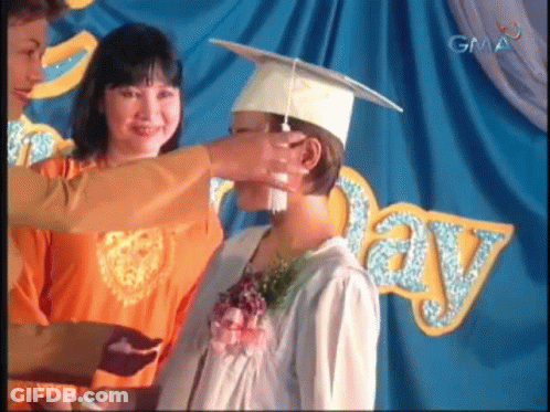 Woman Putting Graduation Cap GIF