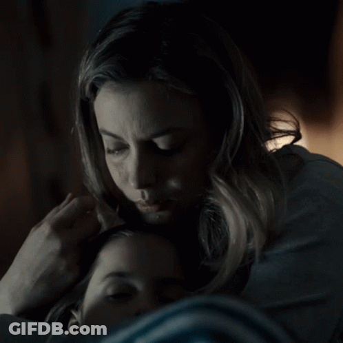 Woman Putting Hand On Child's Forehead GIF
