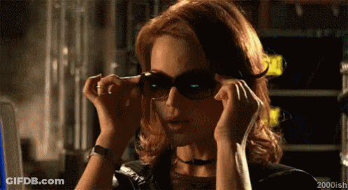 Woman Putting On Sunglasses GIF