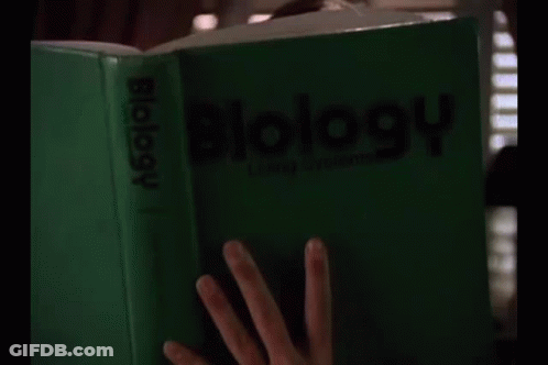 Woman Reading Biology Book GIF