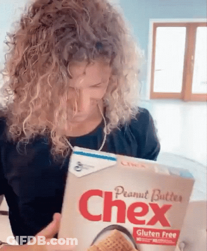 Woman Reading Chex Peanut Butter Box GIF