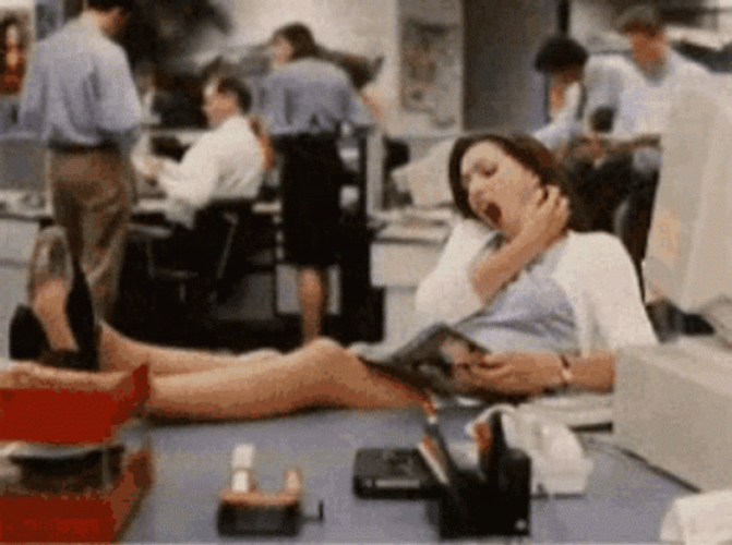 Woman Reading Magazine Pretending To Work GIF
