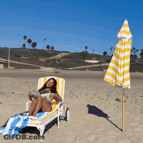 Woman Reading Newspaper On Beach Chair GIF