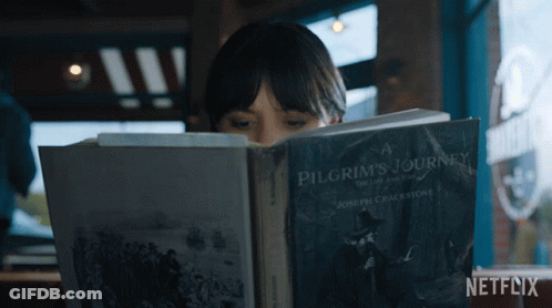 Woman Reading Pilgrim's Journey Book GIF