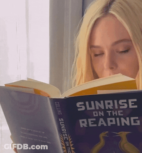 Woman Reading Sunrise On The Reaping GIF