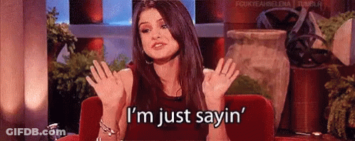 Woman Red Couch Hands Up I'm Just Sayin GIF