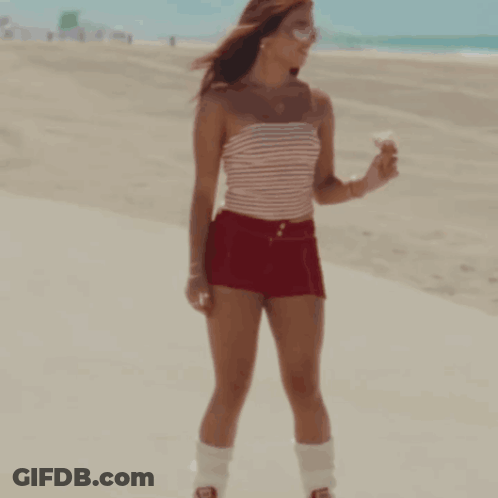Woman Red Shorts Striped Top Holding Ice Cream GIF