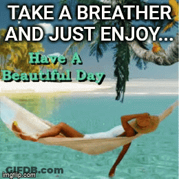 Woman Relaxing In Hammock Over Ocean GIF