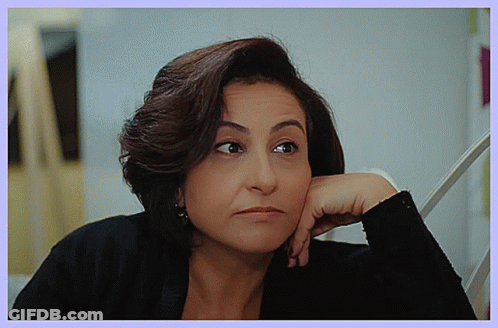 Woman Resting Hand On Chin With Serious Look GIF